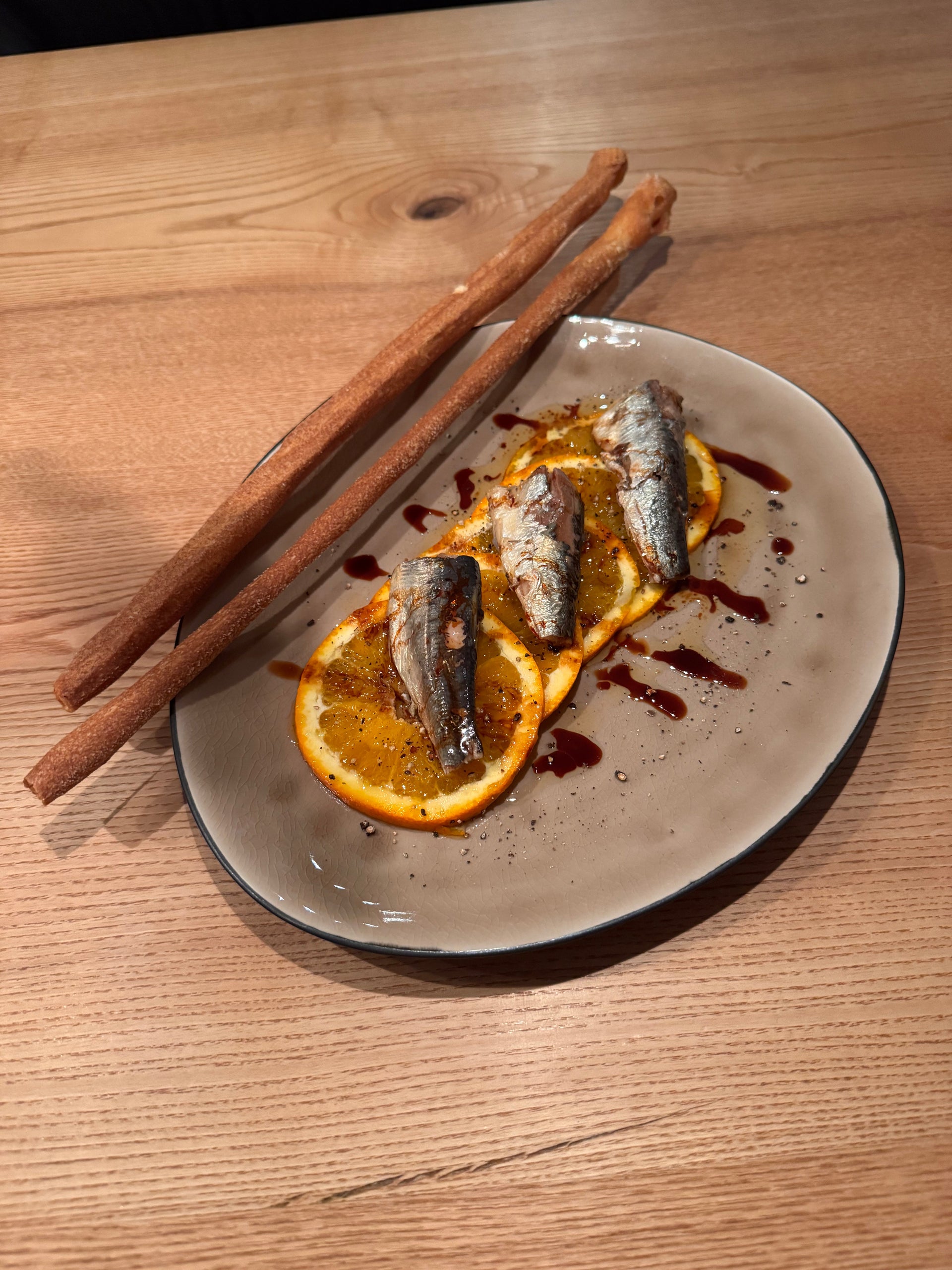 Sardinen auf Orangencarpaccio